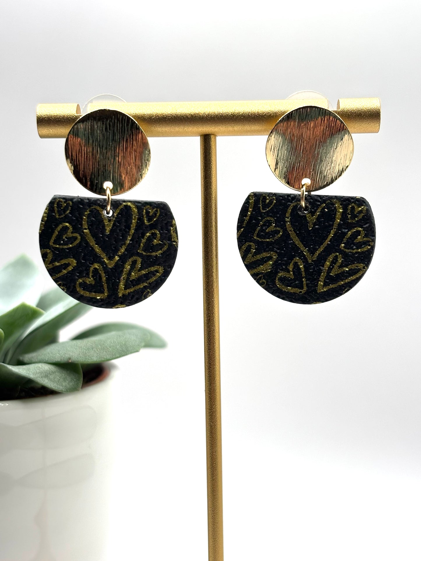 The one with the hearts black gold