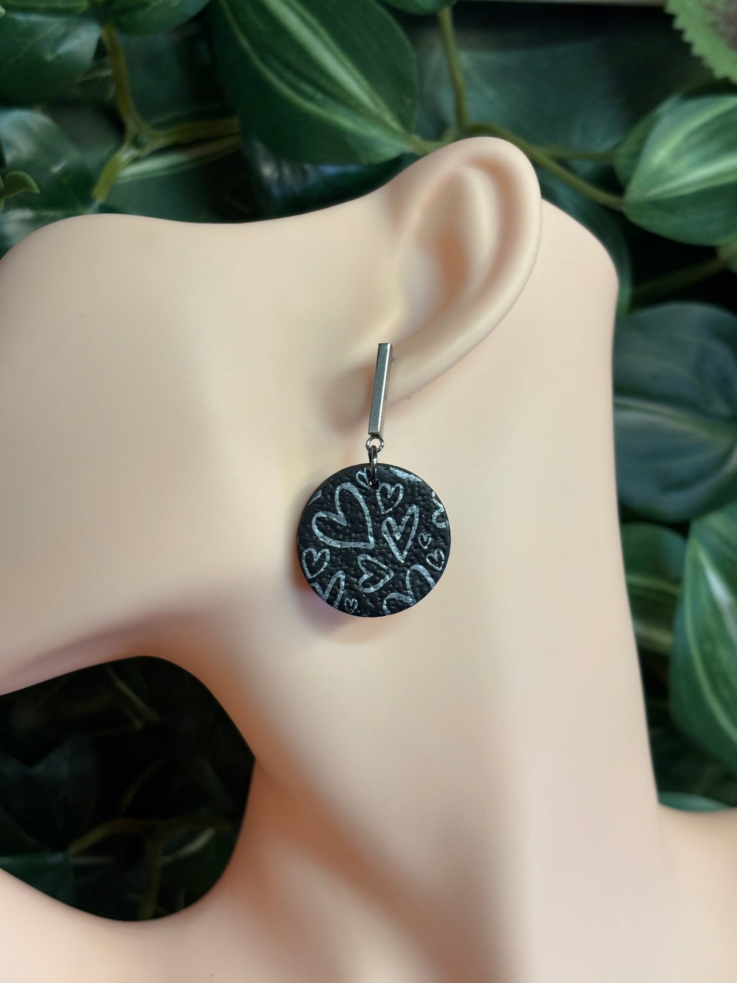 The one with the hearts round black/silver