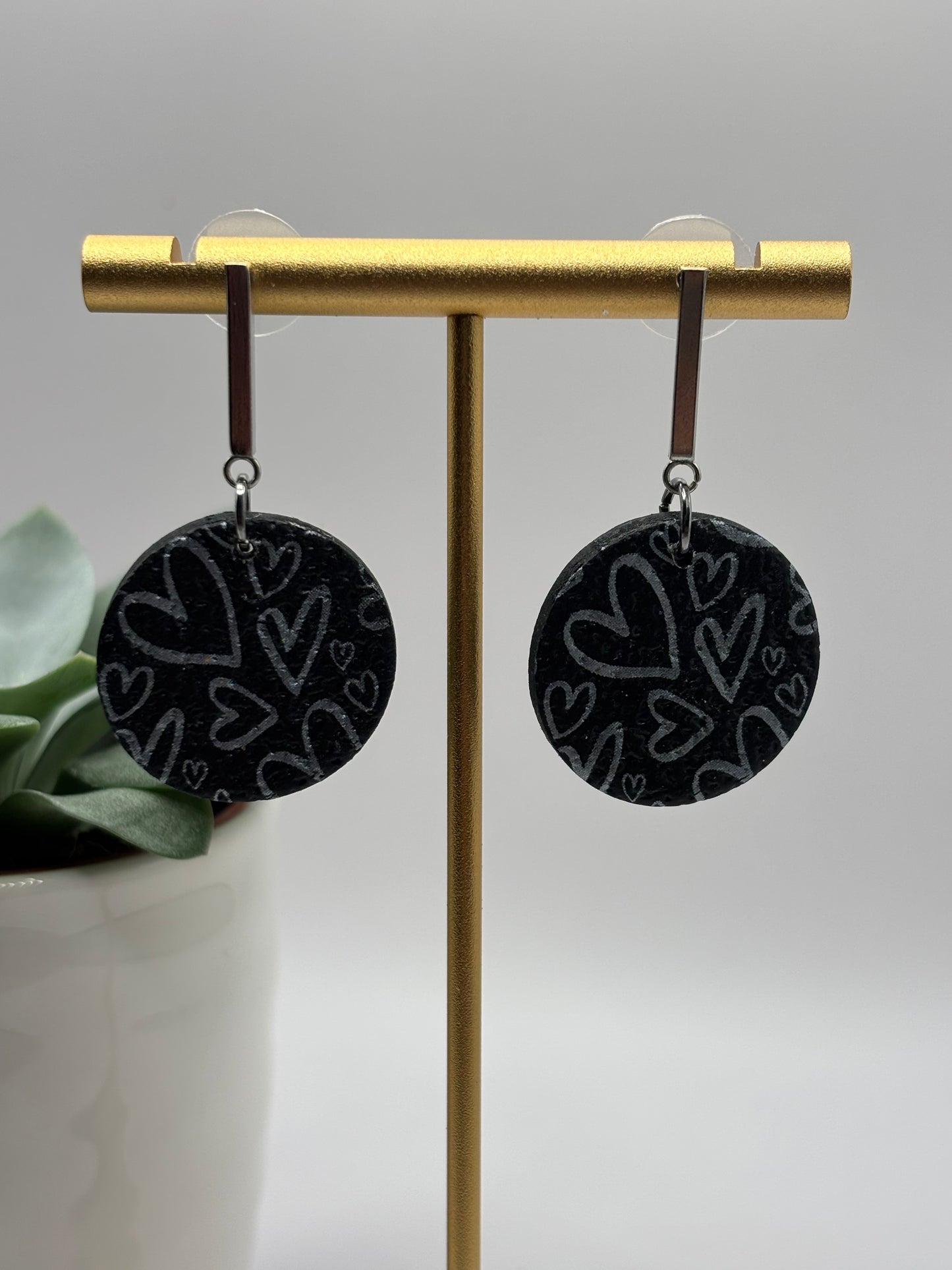 The one with the hearts round black/silver